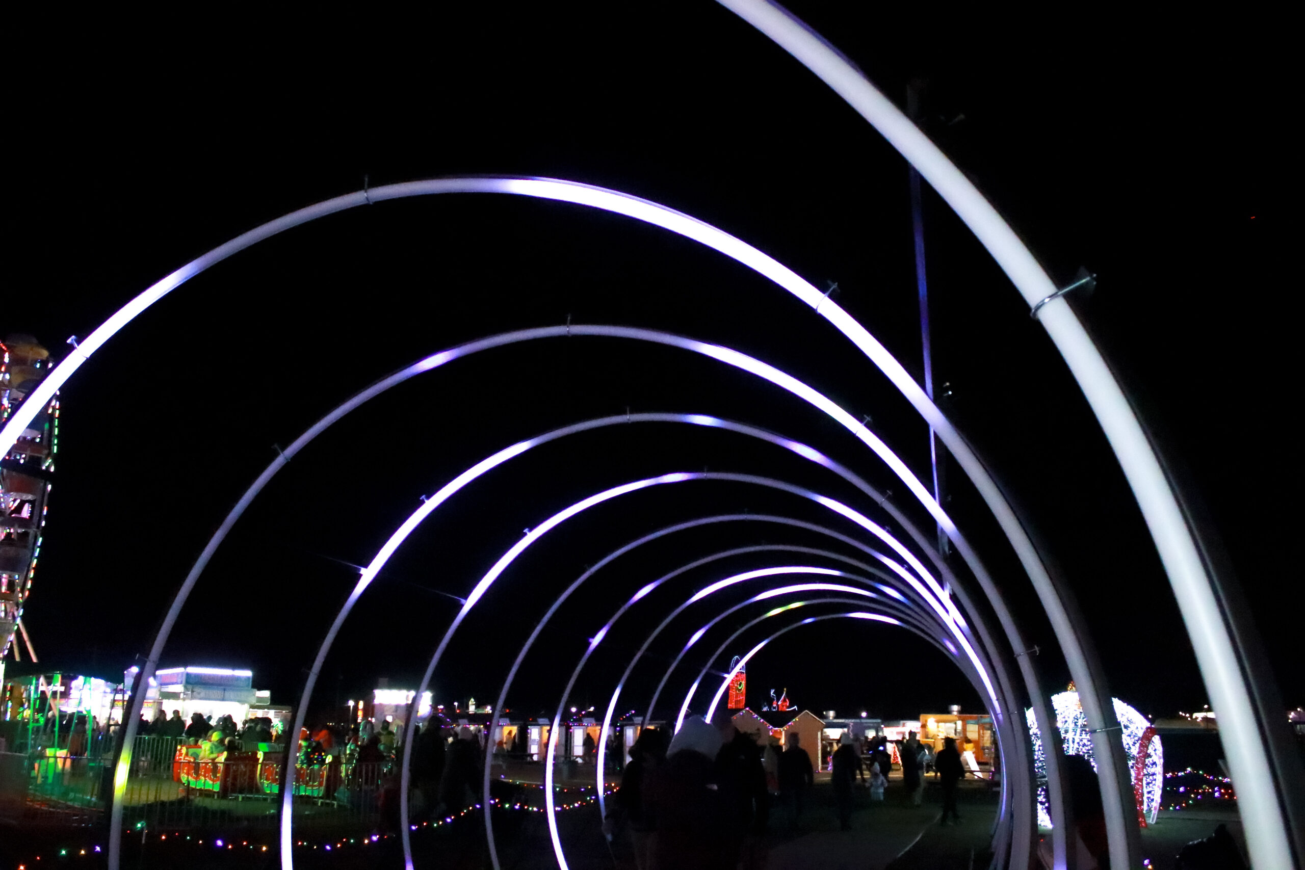 The glowing neon ring tunnel on the Maryland Holiday Light Spectacular trail