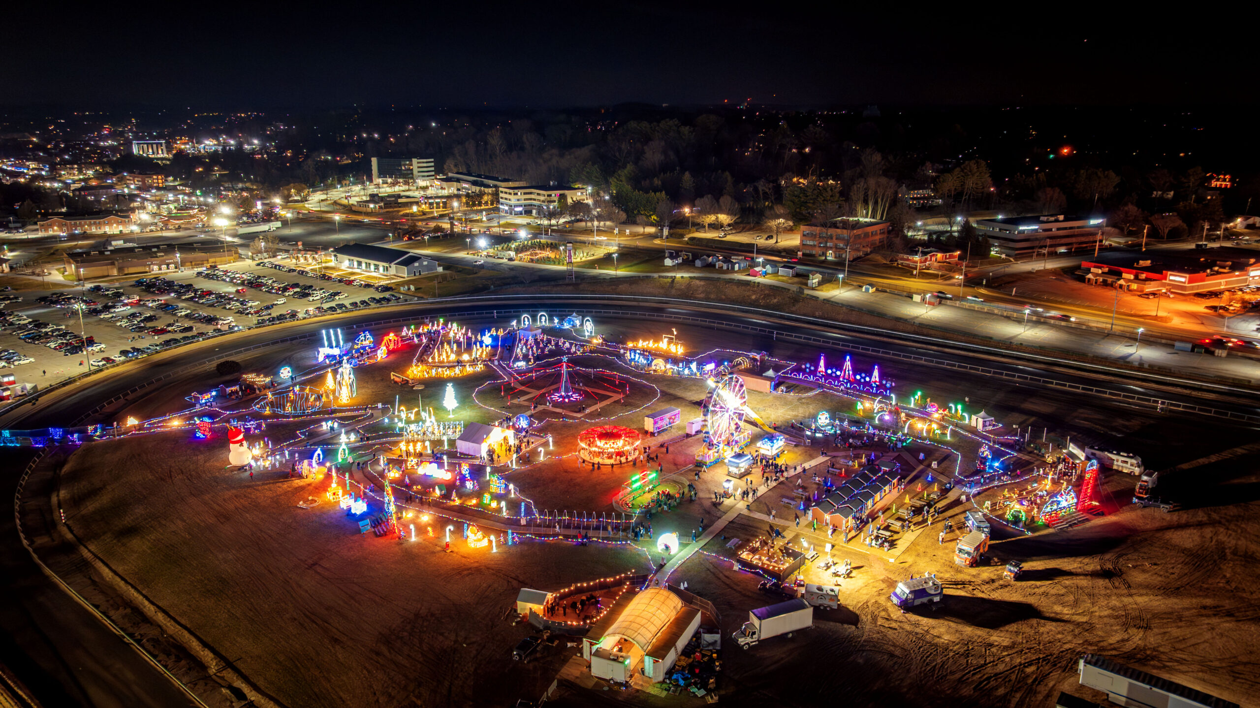 Aerial view of the Maryland Holiday Light Spectacular glowing across the Timonium fairgrounds at night
