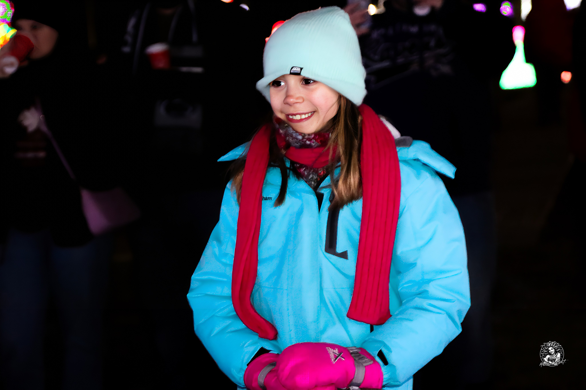 A family walking together through the holiday light display in Timonium, Maryland